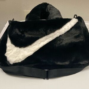 Nike Black and White Travel Bag with Iconic Swoosh